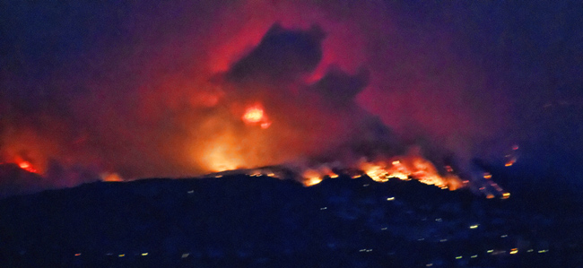 Waldo Canyon Fire flames on Colorado Springs hilltop, evening 26 June 2012.
